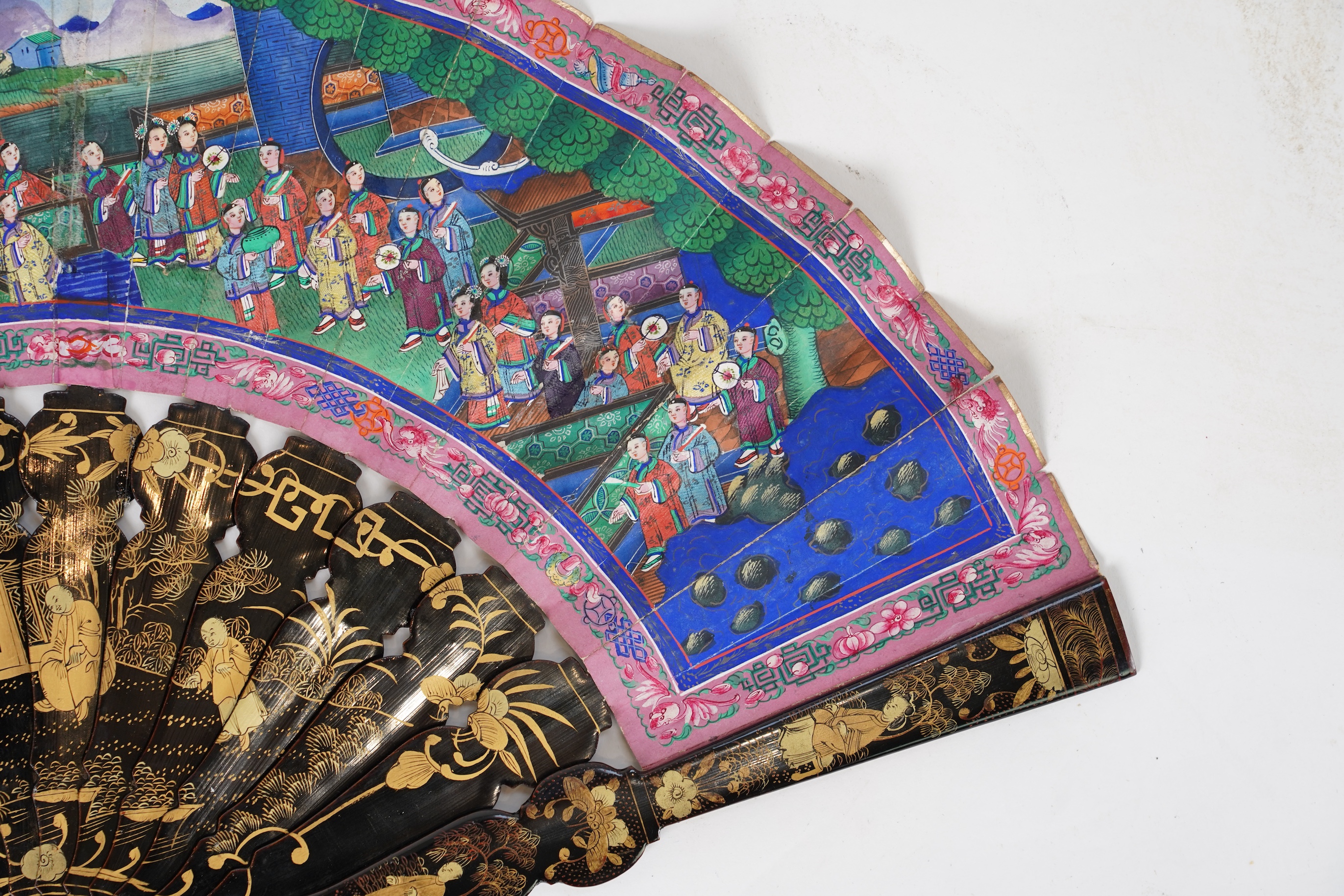 Three Chinese gilt-decorated black lacquer and painted leaf fans, 19th century
